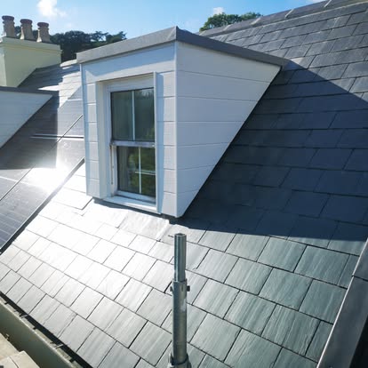 Slate dormer with leadwork detailing on a Jersey roof