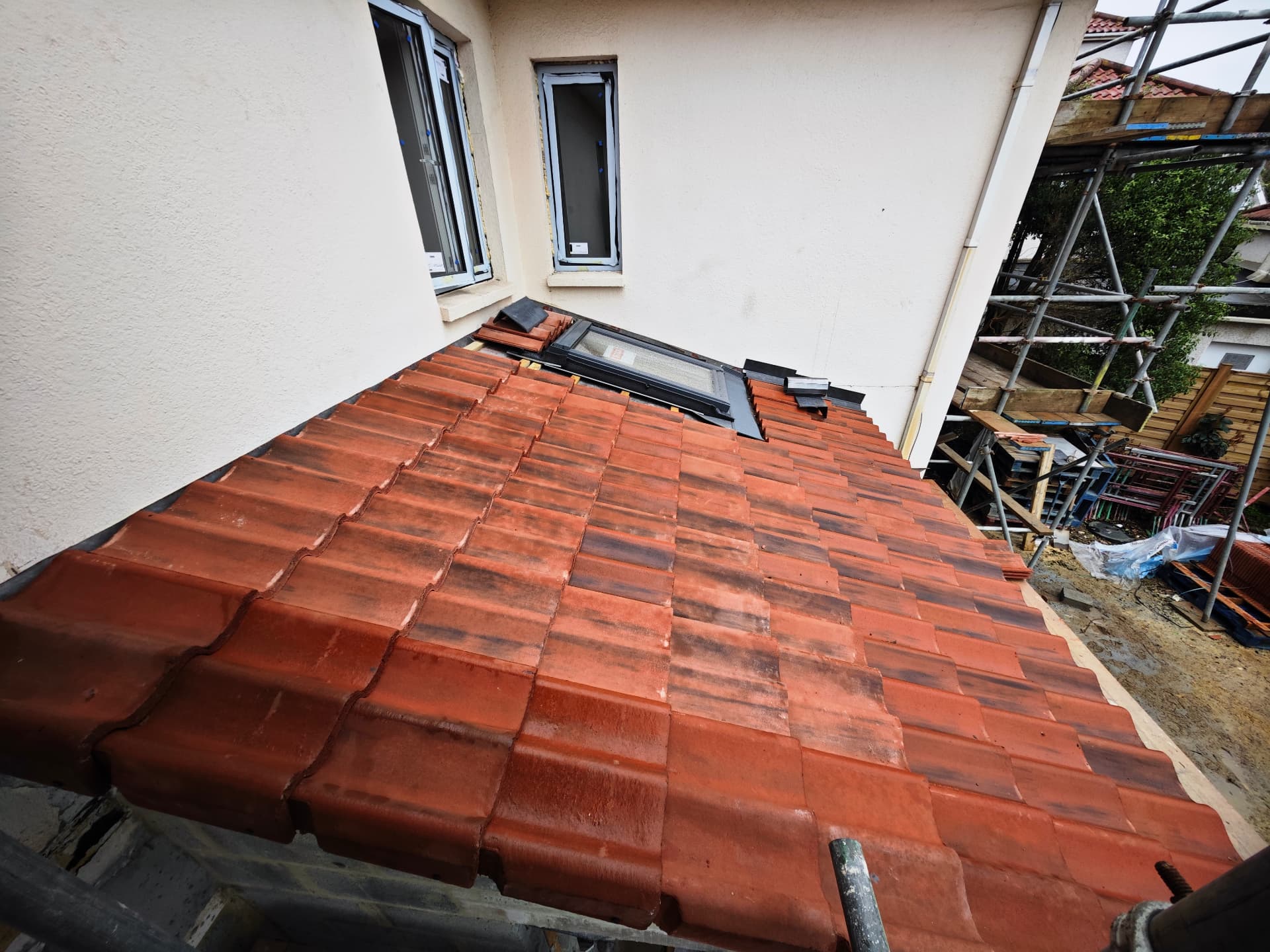 Small tiled lean-to roof with new Velux window and lead flashings, Sherringham