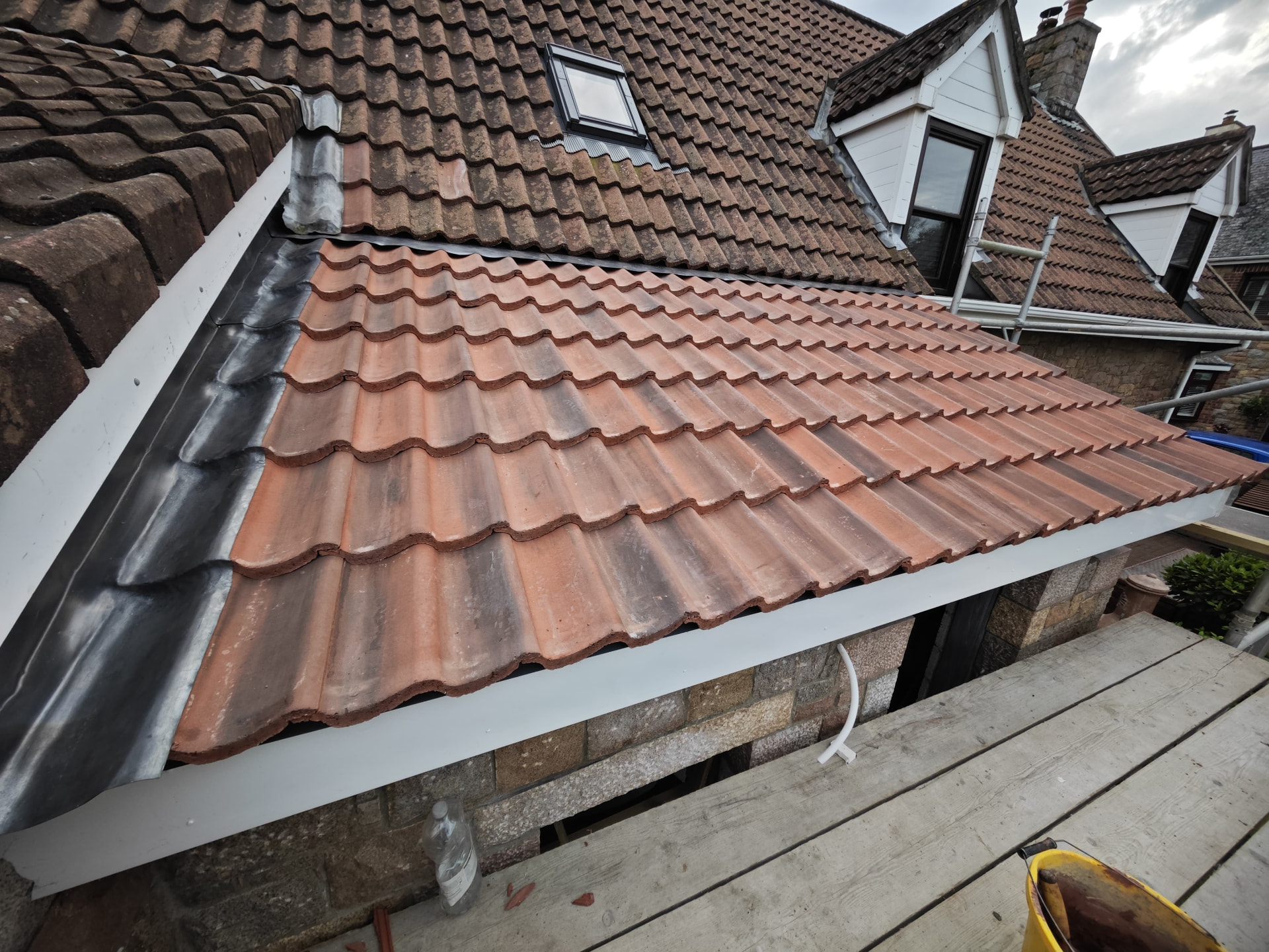 Completed tiled lean-to roof with lead soakers and flashings, Les Chaumiers