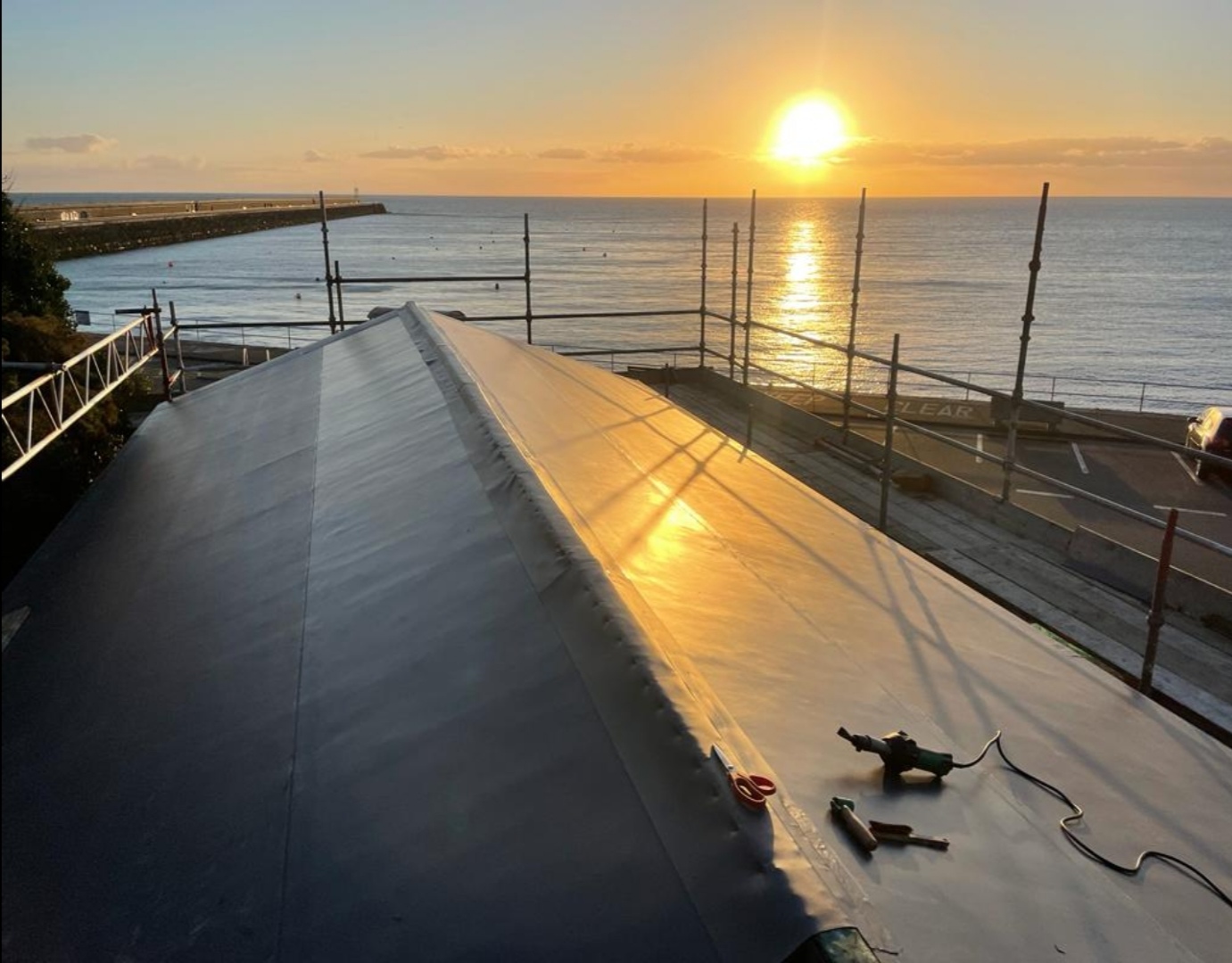 SikaPlan single-ply membrane roof at sunrise over the bay, St. Catherines fisheries