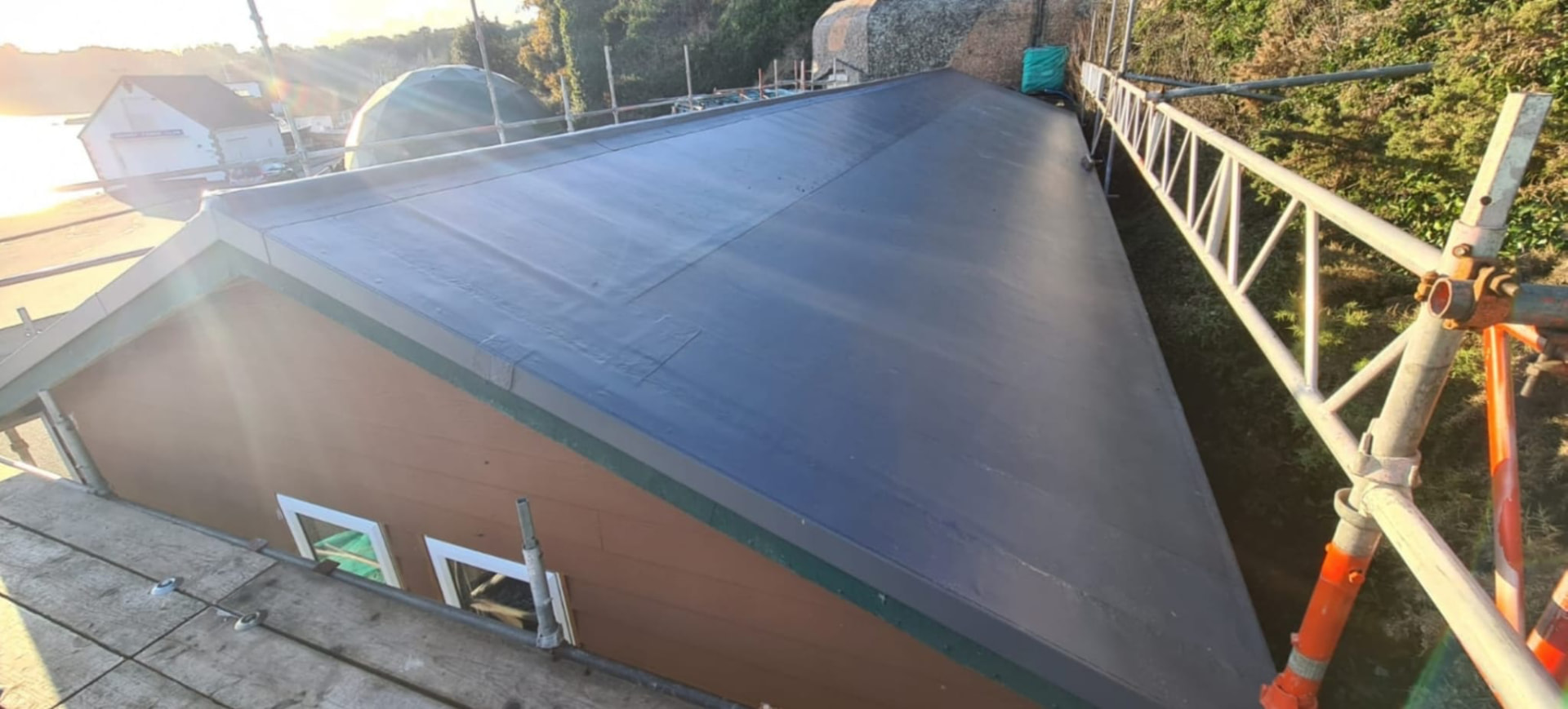 Completed SikaPlan single-ply membrane roof on a timber-clad fisheries building, St. Catherines