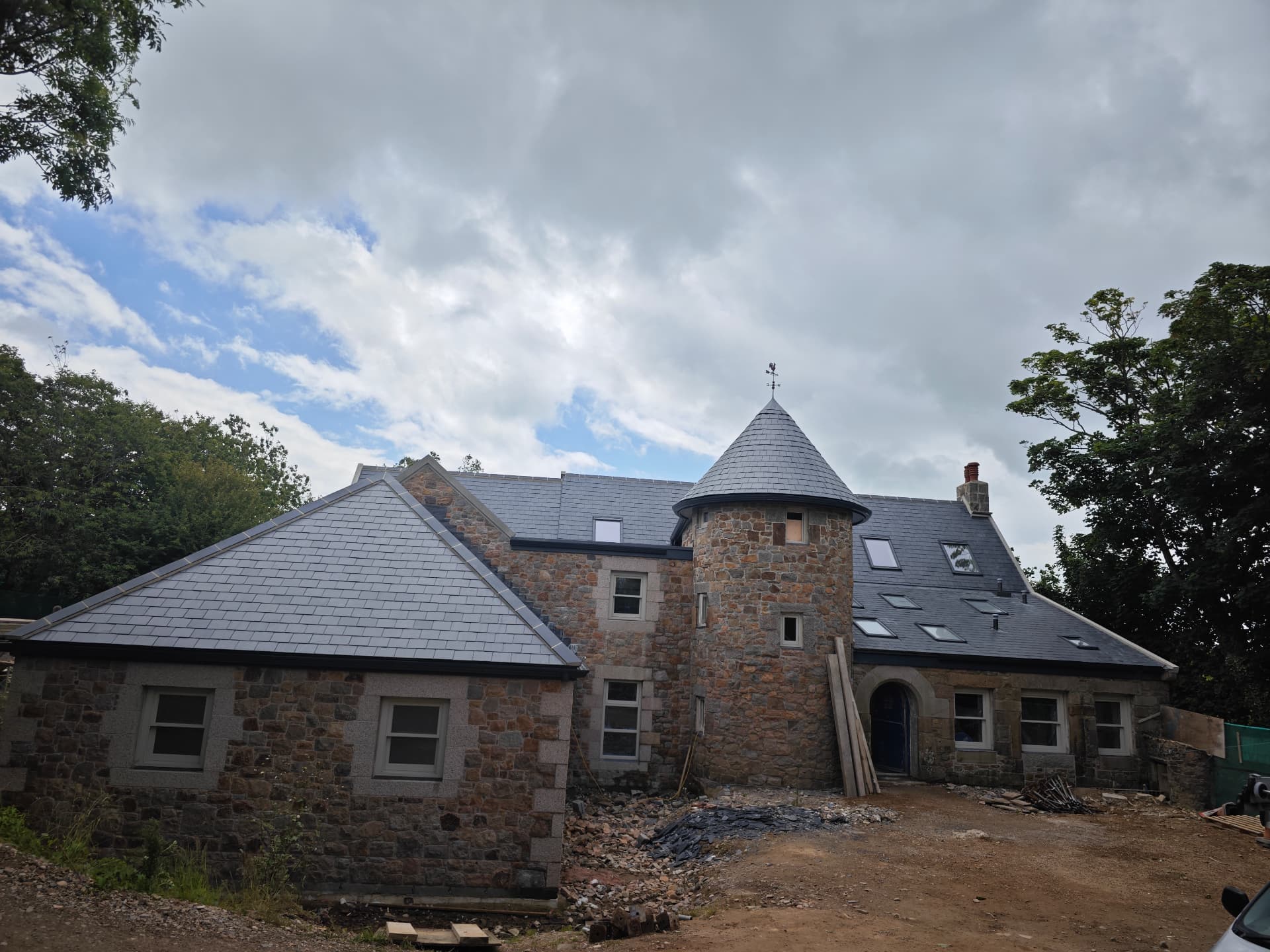 Full reroof in Spanish slate with granite turret and lead dormers, La Grande Rue