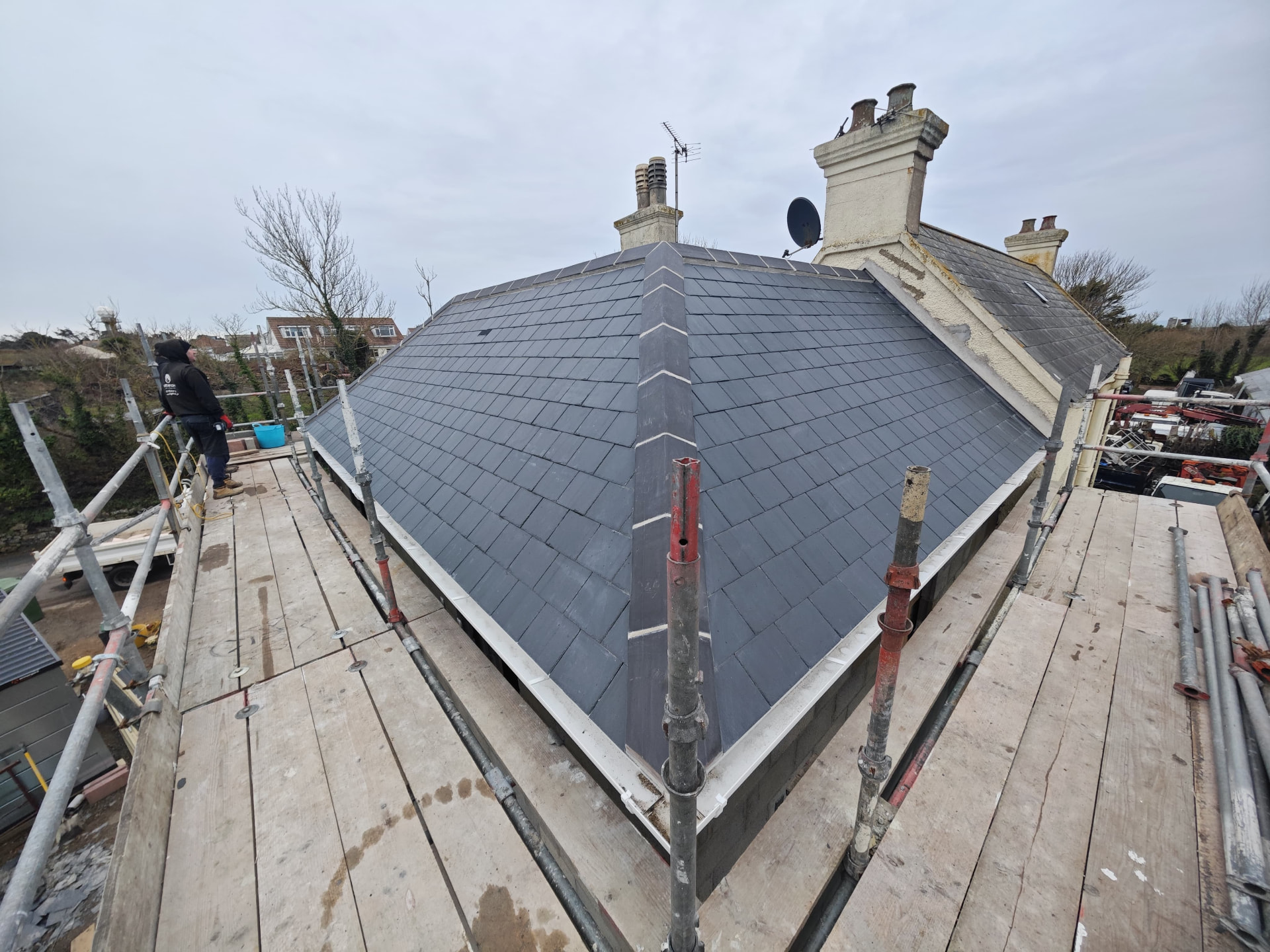 Hipped slate roof on a new extension with lead hips, Corbiere