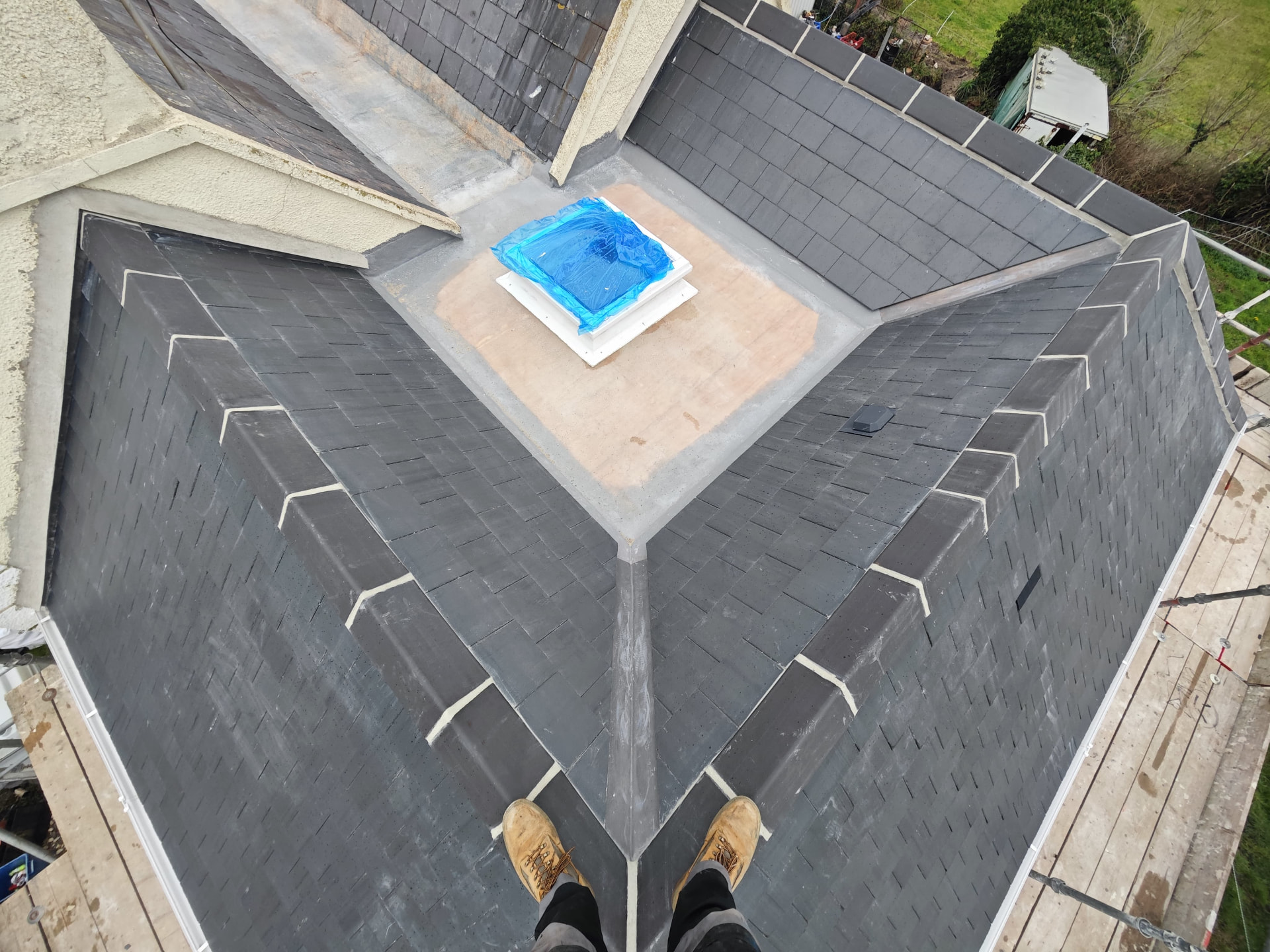 Aerial view of slate valleys and rooflight on a new extension, Corbiere
