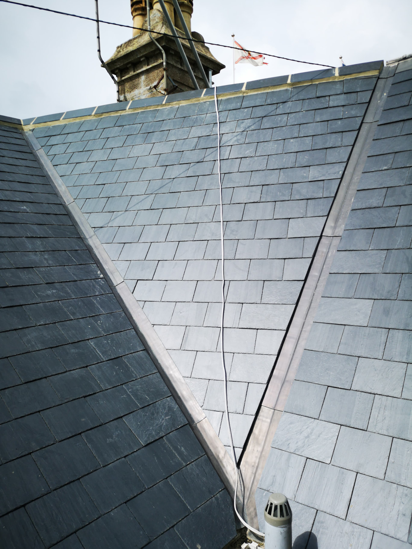New slate roof with lead hips and granite chimney, Broad Street