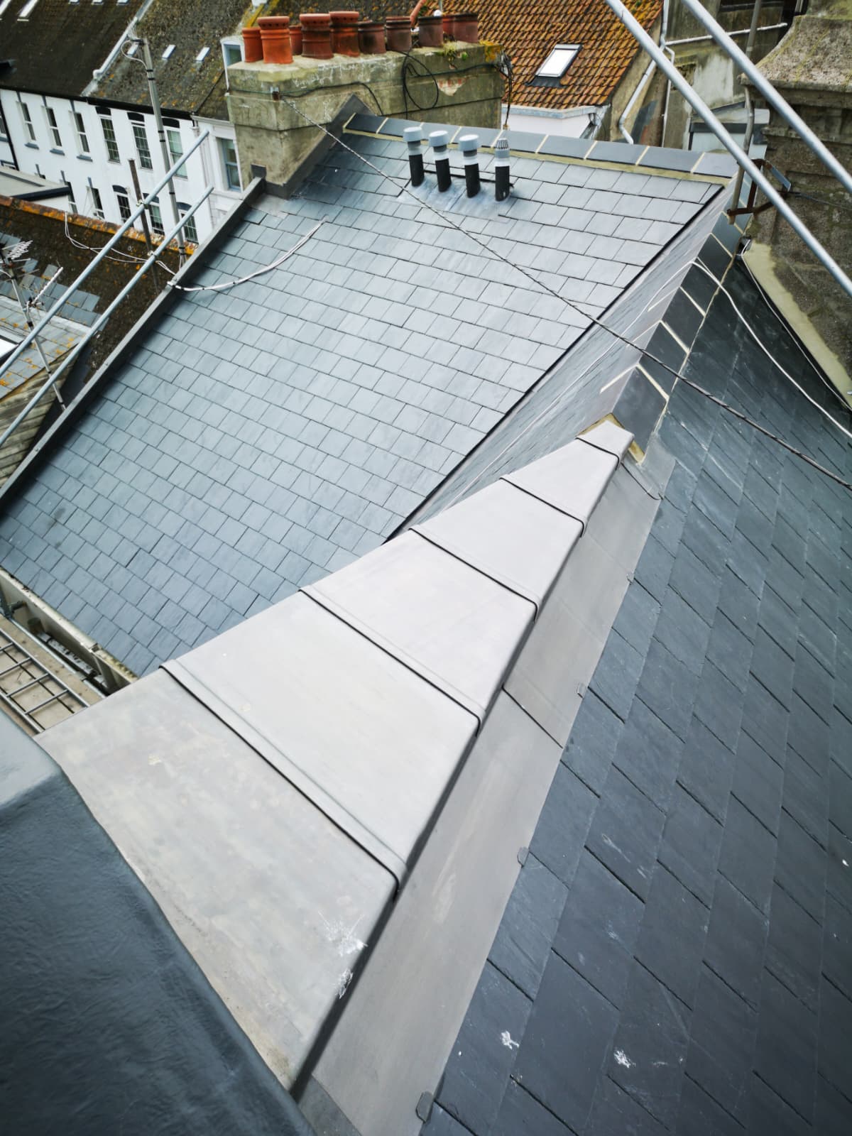 Slate roof with wide lead ridge capping viewed from above, Broad Street