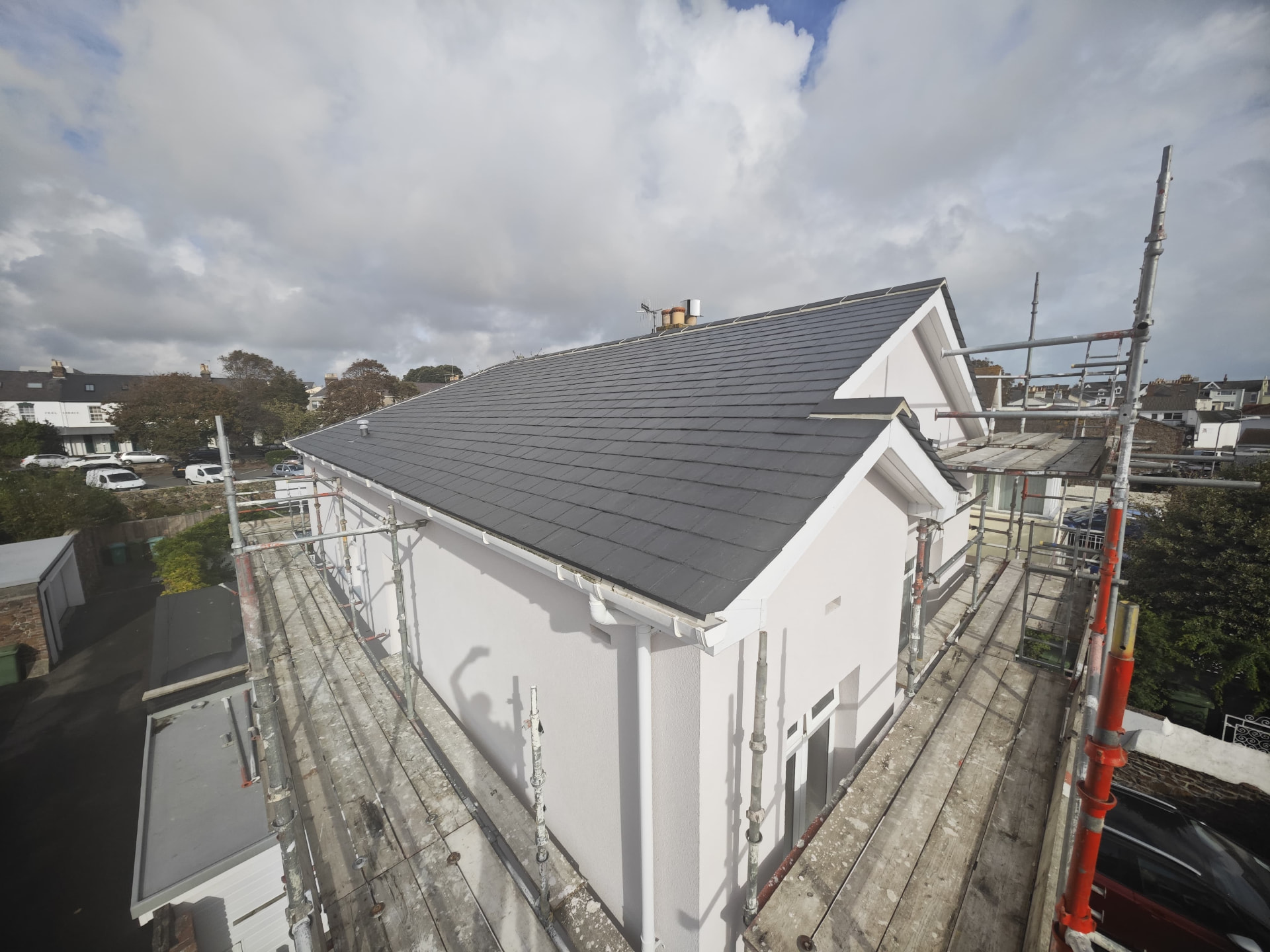 Finished slate roof with gable ends and new guttering, L'Abri