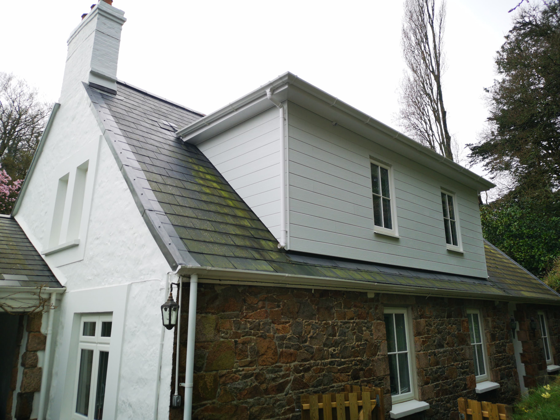 Slate roof with lead capping to Jersey verge and HardiPlank clad dormer, Quarry House