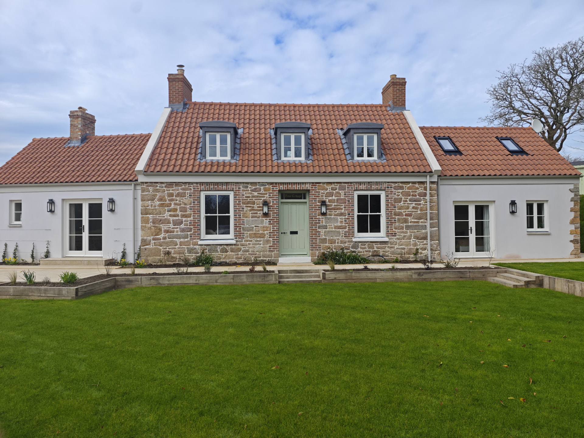 New build granite cottage with clay pantile roof and lead dormers, Rose Cottage