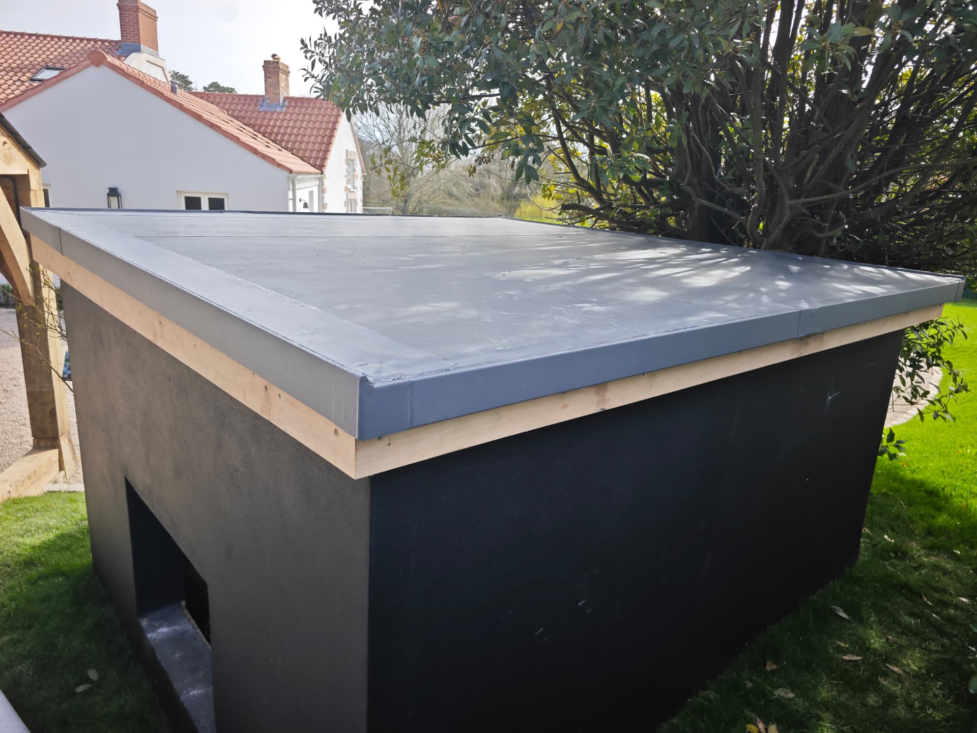Lead flat roof with welted seams to a garden outbuilding, Rose Cottage