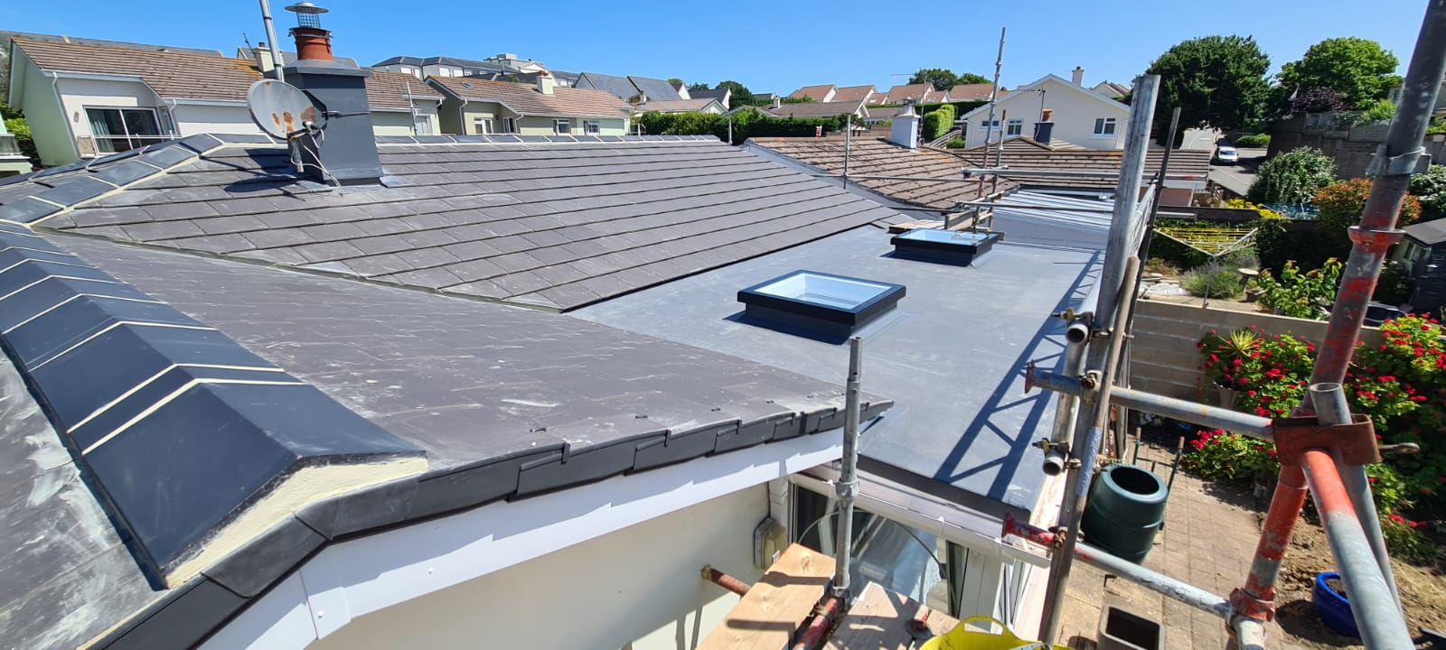 Reroofed slate slopes with membrane flat roof and rooflights, Clos de Patier