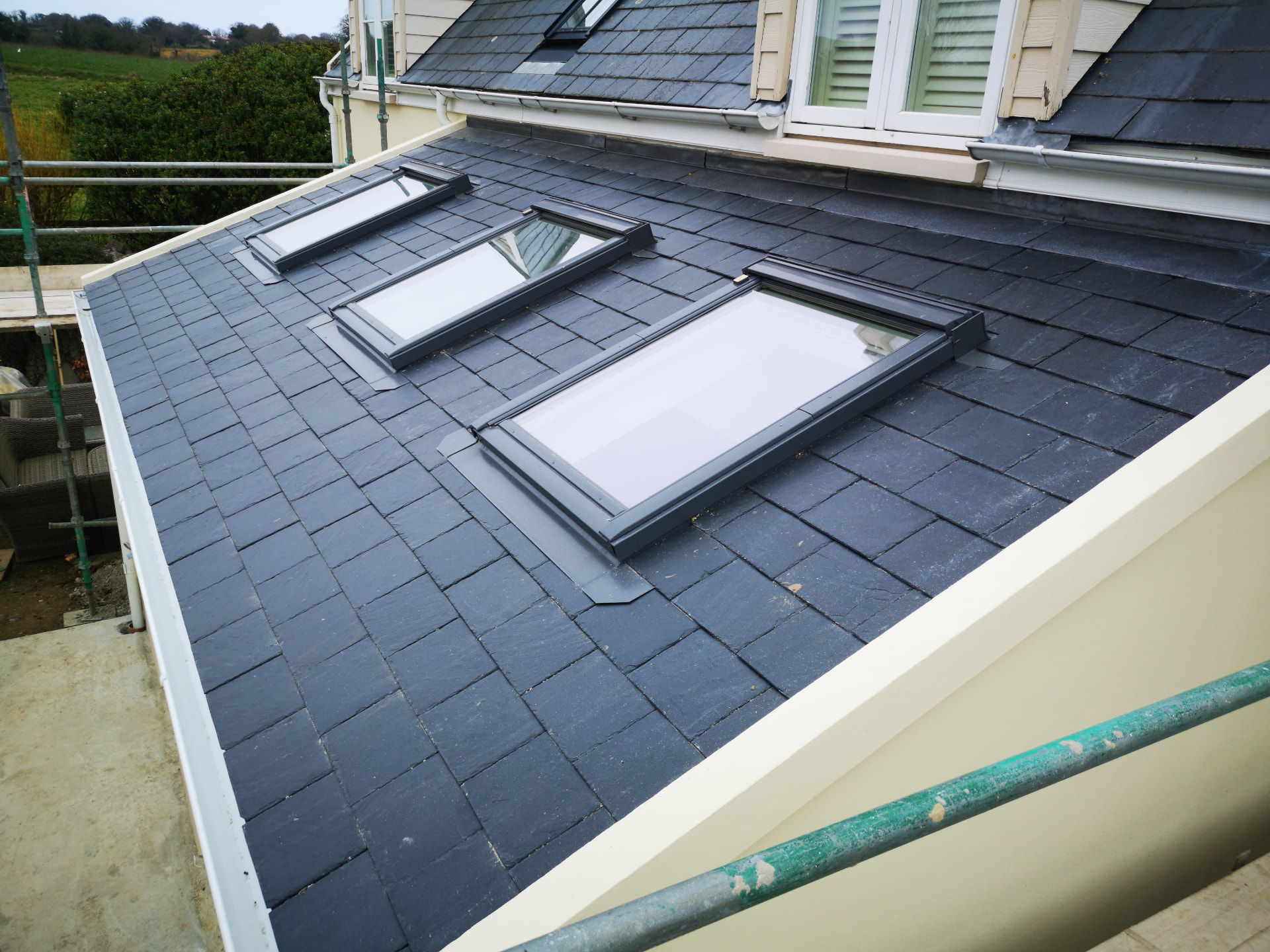 Slated lean-to roof with three Velux rooflights and leadwork, Rue du Hanbey